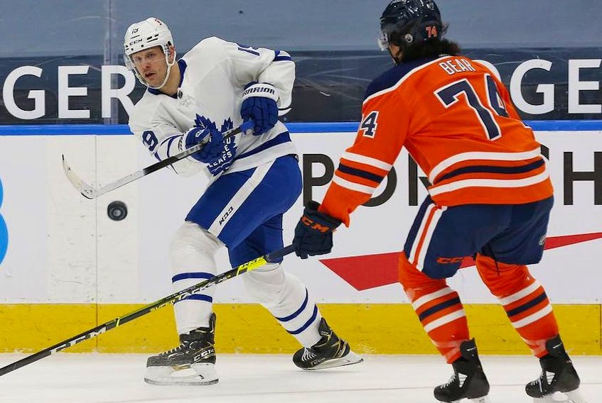 Toronto Maple Leafs forward Jason Spezza makes a pass in front of Edmonton Oilers defensemen Ethan Bear during the second period at Rogers Place. 