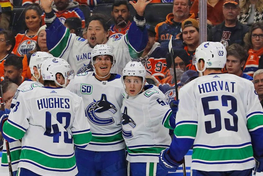 The Vancouver Canucks celebrate a goal by forward Loui Eriksson against the Edmonton Oilers at Rogers Place on Nov. 30.
