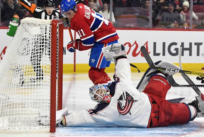  Columbus Blue Jackets goalie Elvis Merzlikins makes a save against Canadiens forward Brendan Gallagher at the Bell Centre on Sunday, Feb. 2, 2020.