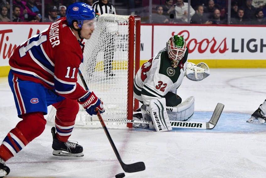  Canadiens forward Brendan Gallagher looks to pass the puck next to Wild goalie Alex Stalock Thursday night. Gallagher scored his third goal of the year in the third period.
