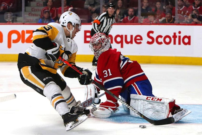 Canadiens goalie Carey Price makes a save against the Pittsburgh Penguins' Brandon Tanev during game at the Bell Centre in Montreal on Jan. 4, 2020.
