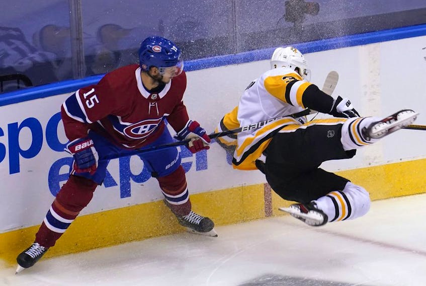 Canadiens' Jesperi Kotkaniemi takes down Penguins defenceman Brian Dumoulin during Eastern Conference qualifications last week. The young centre was a difference-maker for Montreal in the series.