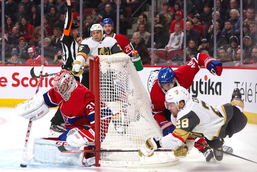  Vegas Golden Knights’ William Carrier (28) shoots the puck against Canadiens goaltender Carey Price as Nate Thompson (44) defends at Bell Centre in Montreal on Saturday, Jan. 18, 2020.