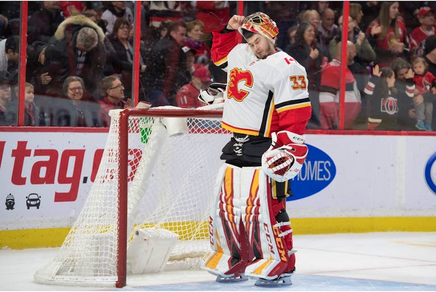 Jan 18, 2020; Ottawa, Ontario, CAN; Calgary Flames goalie David Rittich (33) reacts after allowing a goal in the second period against the Ottawa Senators at the Canadian Tire Centre. Mandatory Credit: Marc DesRosiers-USA TODAY Sports ORG XMIT: USATSI-405739