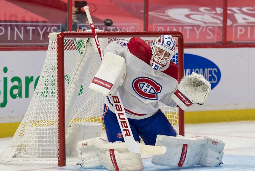 Feb 21, 2021; Ottawa, Ontario, CAN; Montreal Canadiens goalie Jake Allen (34) makes a save in the second period against the Ottawa Senators at the Canadian Tire Centre. Mandatory Credit: Marc DesRosiers-USA TODAY Sports