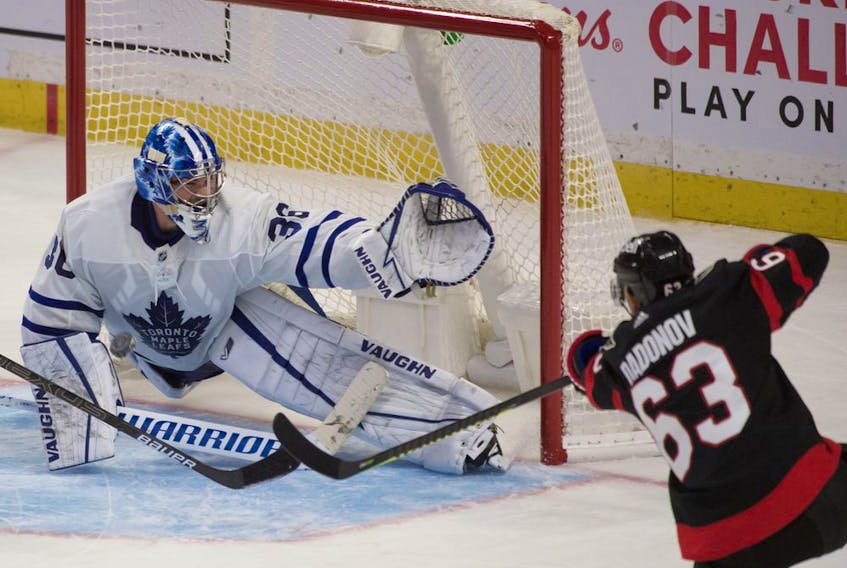 Toronto Maple Leafs goalie Jack Campbell makes a save on a shot from  Ottawa Senators right wing Evgenii Dadonov  in the third period at the Canadian Tire Centre. 