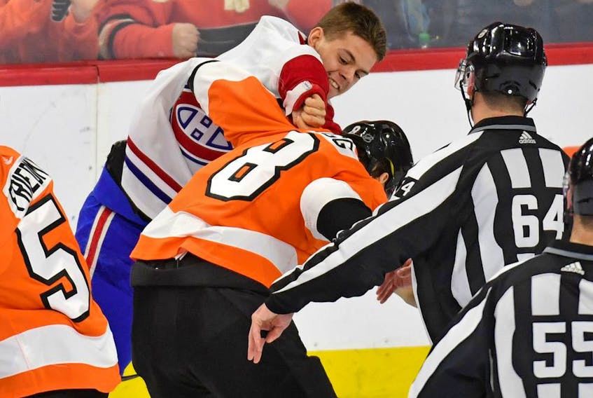 Canadiens' Jesperi Kotkaniemi lands a punch during his fight with Flyers defenceman Robert Hagg Thursday night in Philadelphia.