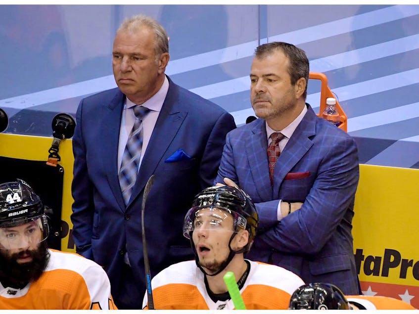 Philadelphia Flyers head coach Alain Vigneault (right) and assistant Michel Therrien. - Dan  Hamilton