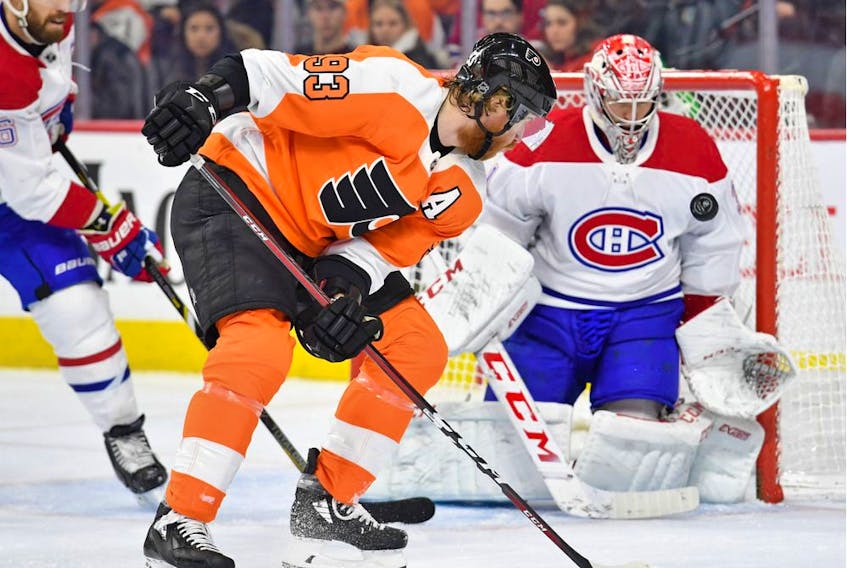  Flyers’ Jakub Voracek deflects the puck toward Canadiens goaltender Carey Price during the second period at Wells Fargo Center in Philadelphia Thursday night.