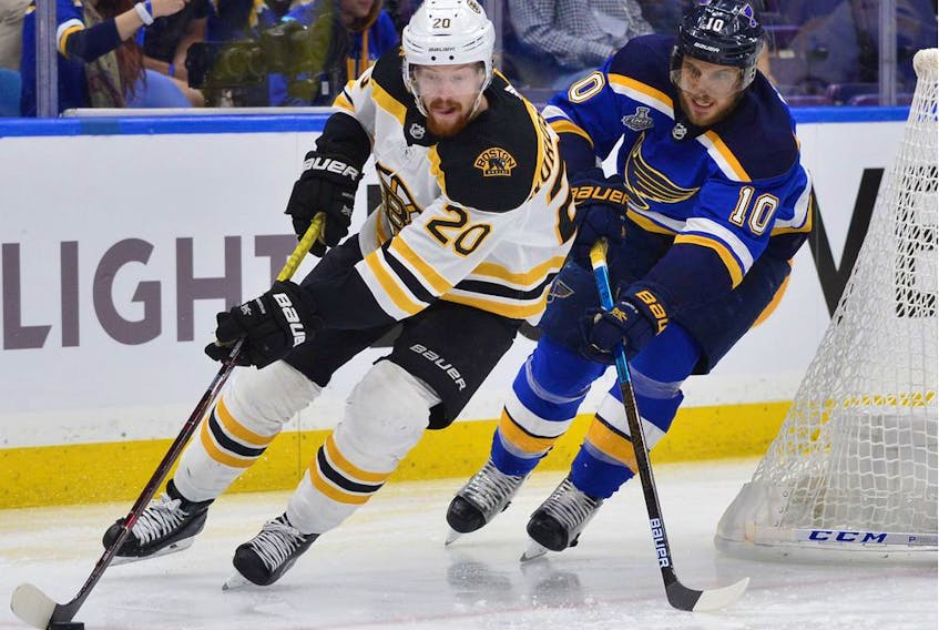 The Boston Bruins’ Joakim Nordstrom controls the puck against the St. Louis Blues’ Brayden Schenn During Game 3 of the Stanley Cup Final at the Enterprise Center in St Louis on June 1, 2019.