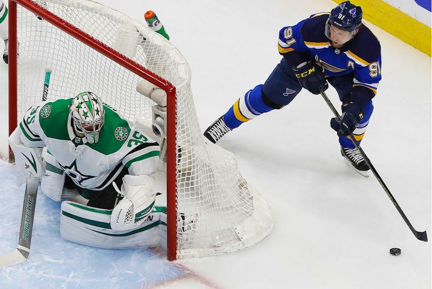 St. Louis Blues' Vladimir Tarasenko looks to make a pass from behind Dallas Stars goalie Anton Khudobin's net during the third period in the Western Conference qualifications at Rogers Place in Edmonton on Aug. 9.