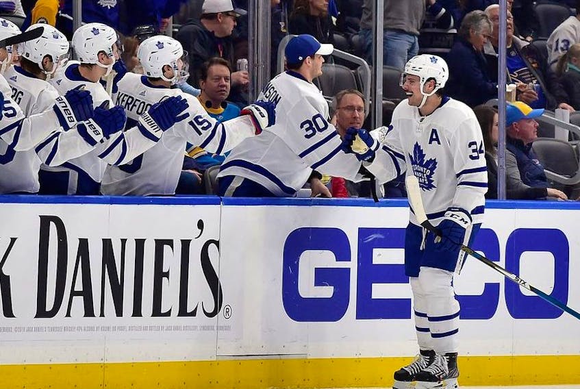 Toronto Maple Leafs center Auston Matthews is congratulated by teammates after scoring during the second period against the St. Louis Blues at Enterprise Center. 