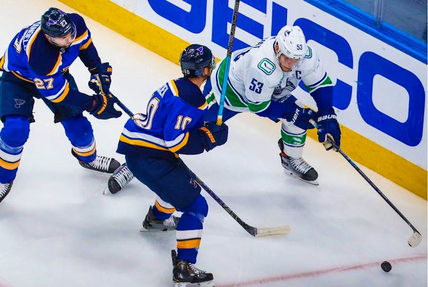 Vancouver captain Bo Horvat, right, scored twice and played a strong game as the Canucks beat the St. Louis Blues 5-2 on Wednesday in Game 1 of their opening-round playoff series in Edmonton.