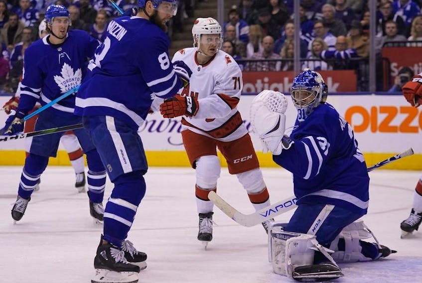 A shot by Carolina Hurricanes forward Nino Niederreiter (not pictured) scores on Toronto Maple Leafs goaltender Frederik Andersen as  defenseman Jake Muzzin and Carolina Hurricanes forward Lucas Wallmark look on during the second period at Scotiabank Arena. 