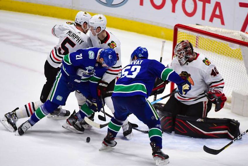 Vancouver Canucks goalie Jacob Markstrom (25) makes a save against the Chicago Blackhawks in the third period at Rogers Arena. Vancouver won 3 -0.