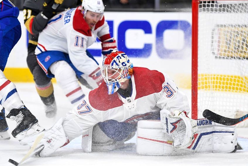Montreal Canadiens goaltender Keith Kinkaid bats the puck away from the net during the second period against the Golden Knights in Las Vegas on Oct. 31, 2019.