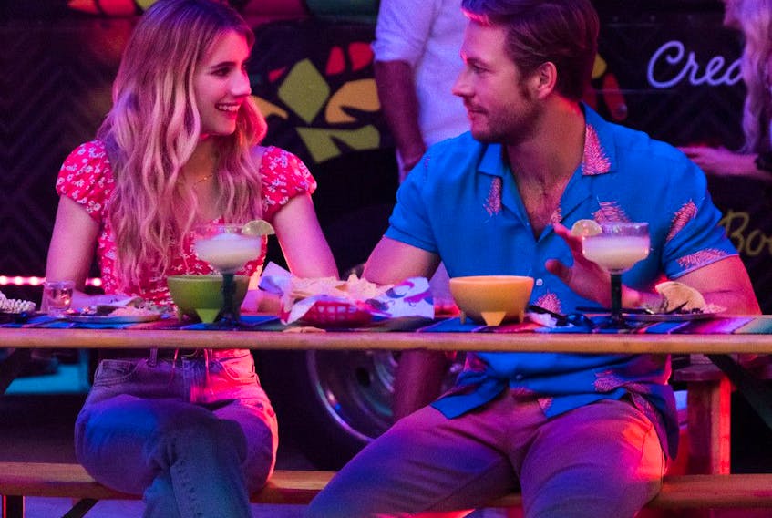 Here's hoping they made time-and-a-half: Emma Roberts and Luke Bracey in Holidate.