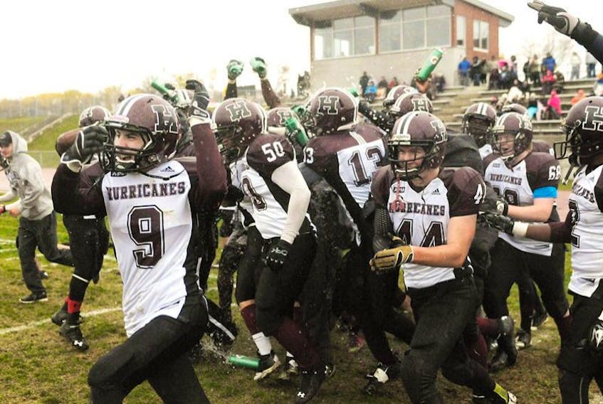 The Holland Hurricanes rush onto the field Saturday after they defeated the UNB Saint John Seawolves to take the Atlantic Football League title. The game was played at MacAdam Field at UPEI.