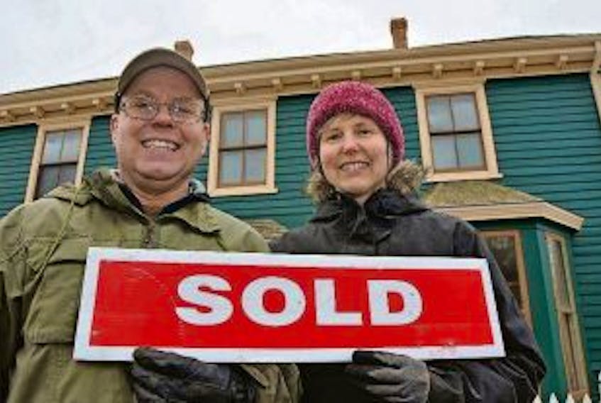 ["File photo of Ken and Jenny Meister shortly after they purchased the historic Holman homestead in Summerside. The couple have since renovated the property and operate Holman's Ice Cream Parlour in part of the building.  "]