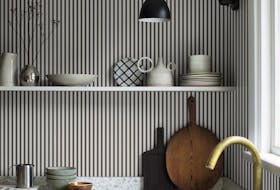 Narrow striped Sandberg wallpaper sets a gentle mood in this unfussy kitchen