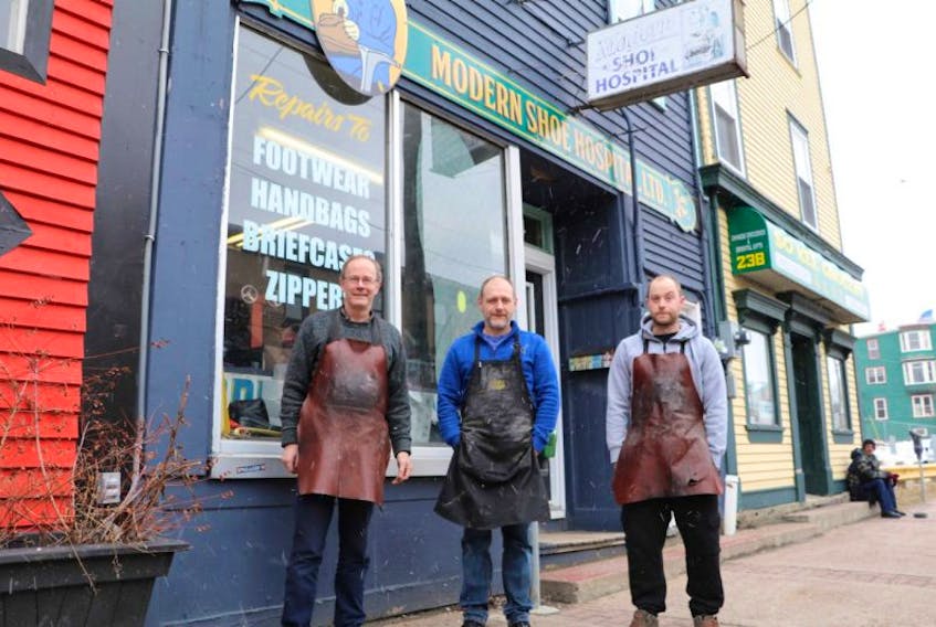 (From left) Kevin Wright, Jim Whey and Adam Wright, outside the Duckworth Street location in St. John’s, where the Modern Shoe Hospital has been saving soles since 1951. From the 1920s until 1951, the shop was located a little further east on Duckworth.