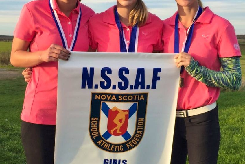<p>The Horton girls’ golf team of Sara Cumby, left, Heather McLean and Meghan McLean holds the provincial banner after capturing the NSSAF championship Oct. 5 at the Links at Penn Hills in Shubenacadie. </p>