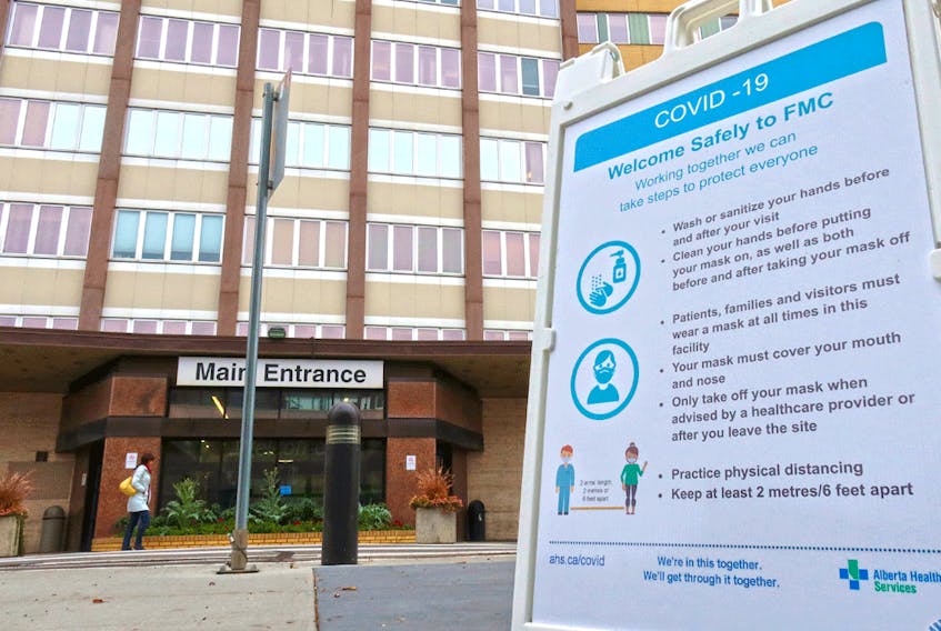 A COVID-19 information sign outside the Foothills Hospital in Calgary.