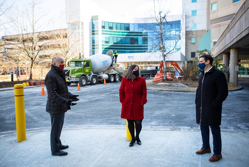Health and Wellness Minister Zach Churchill, Halifax MP Andy Fillmore and IWK Health Centre president and CEO Dr. Krista Jangaard stand hear the site of renovations at the IWK in a photo released by the Nova Scotia government.