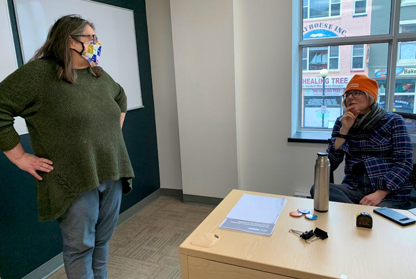 NL NDP campaign communications director Jean Graham (left) has a socially distanced chat with Amanda Will, deputy campaign manager, at the party's headquarters, which overlooks Water Street in St. John's. BARB SWEET/THE TELEGRAM