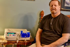 Every night for about nine hours, Ian Hickey is hooked up to this peritoneal dialysis machine that helps keep him alive. ELIZABETH PATTERSON/CAPE BRETON POST