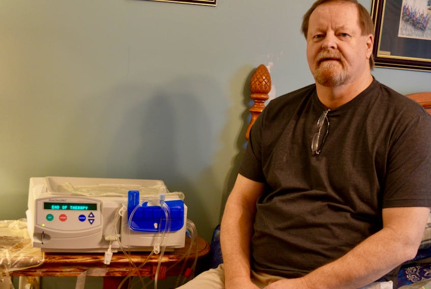 Every night for about nine hours, Ian Hickey is hooked up to this peritoneal dialysis machine that helps keep him alive. ELIZABETH PATTERSON/CAPE BRETON POST