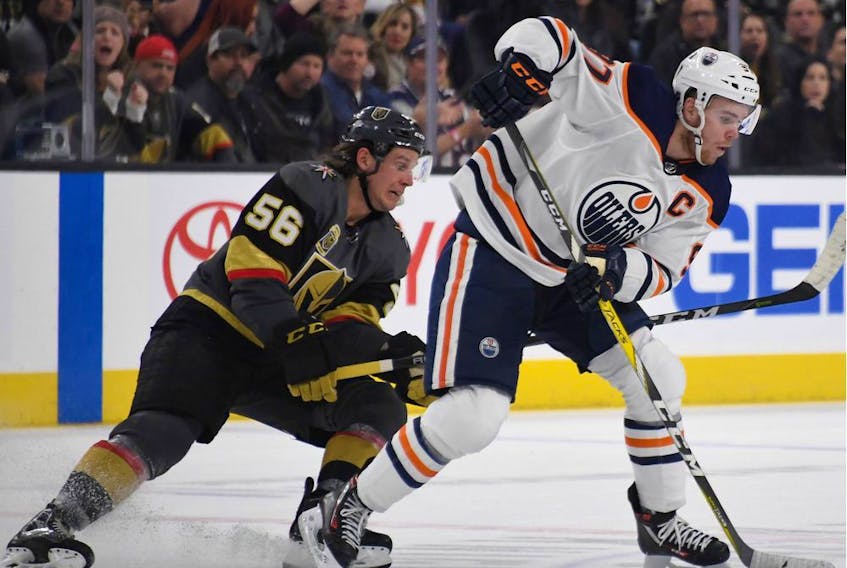 Edmonton Oilers captain Connor McDavid skates against Erik Haula of the Vegas Golden Knights at T-Mobile Arena on Jan. 13, 2018, in Las Vegas. The Oilers won 3-2 in overtime.