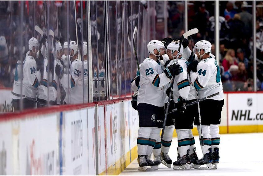 DENVER, COLORADO - APRIL 30: Logan Couture #39 of the San Jose Sharks is congratulated by his teammates after scoring an empty net goal against the Colorado Avalanche in the third period during Game Three of the Western Conference Second Round during the 2019 NHL Stanley Cup Playoffs at the Pepsi Center on April 30, 2019 in Denver, Colorado.