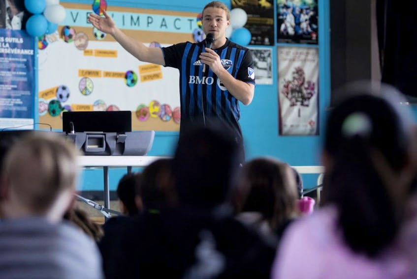  Montreal Impact’s Samuel Piette speaks with students at Philippe-Morin school in Montreal on March 26, 2019.