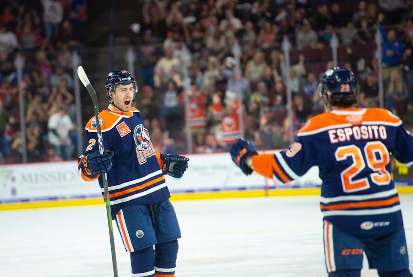 Evan Bouchard of the Bakersfield Condors celebrates a goal with Luke Esposito during the 2019-2020 season.
