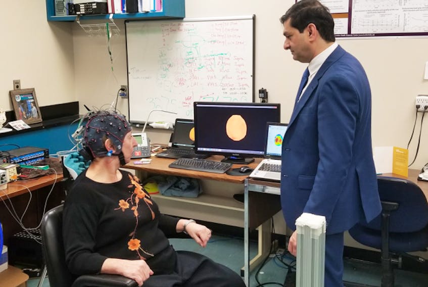  Parkinson’s patient Gail Jardine with Dr. Mandar Job in his lab at Western University.