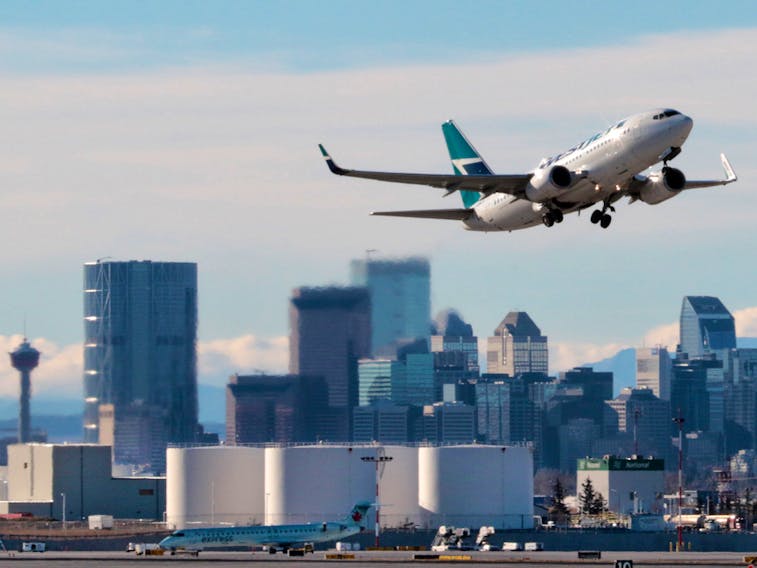A WestJet aircraft takes off from Calgary International Airport.