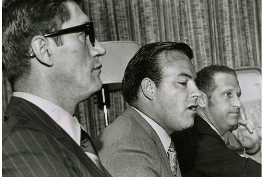 Then St. Louis Blues coach Al Arbour, left, and general manager Scotty Bowman, centre, are pictured on Sept. 11, 1970. Toronto Sun files