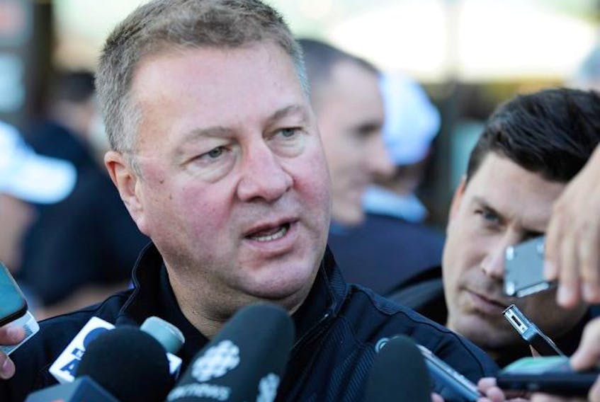 Vancouver Canucks president and general manager Mike Gillis speaks to the media in 2012.