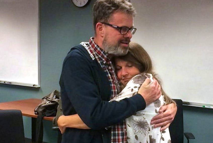  Kevin and Julie Garratt embrace at Vancouver airport following his return to Canada in 2016.