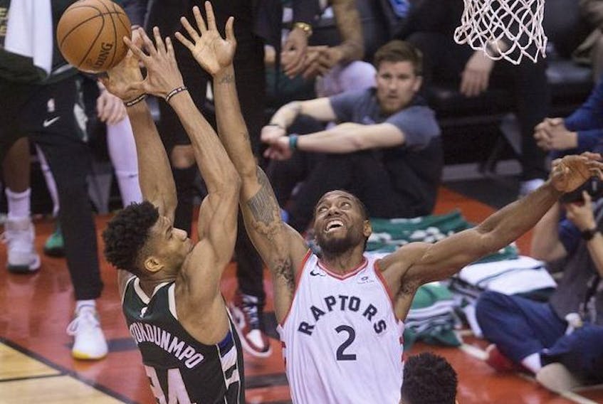 Giannis Antetokounmpo  &amp; Kawhi Leonard in 4th quarter action in Game 3 of the Eastern Conference Finals as the Toronto Raptors go on to beat the Milwaukee Bucks,  in Toronto, Ont. on Monday May 20, 2019. Stan Behal/Toronto Sun/Postmedia Network