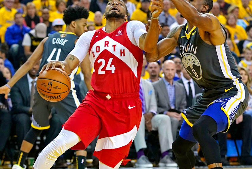 Toronto Raptors forward Norman Powell (24) drives to the basket against Golden State Warriors guard Andre Iguodala (9) during the second quarter in game 4 of the 2019 NBA Finals at Oracle Arena. Kyle Terada-USA TODAY Sports 