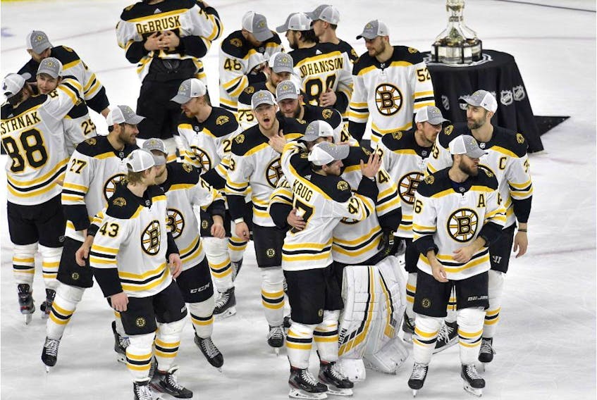  The Boston Bruins celebrate after defeating the Carolina Hurricanes in Game 4 to win the Eastern Conference Final on Thursday, May 16, 2019, in Raleigh, N.C.