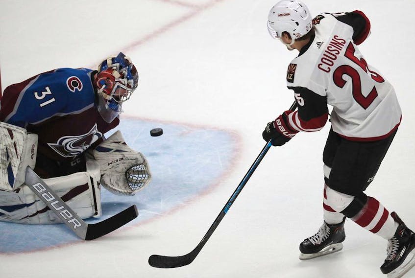  Colorado Avalanche goaltender Philipp Grubauer, left, stops a shot by Arizona Coyotes centre Nick Cousins during a shootout on March 29, 2019, in Denver.