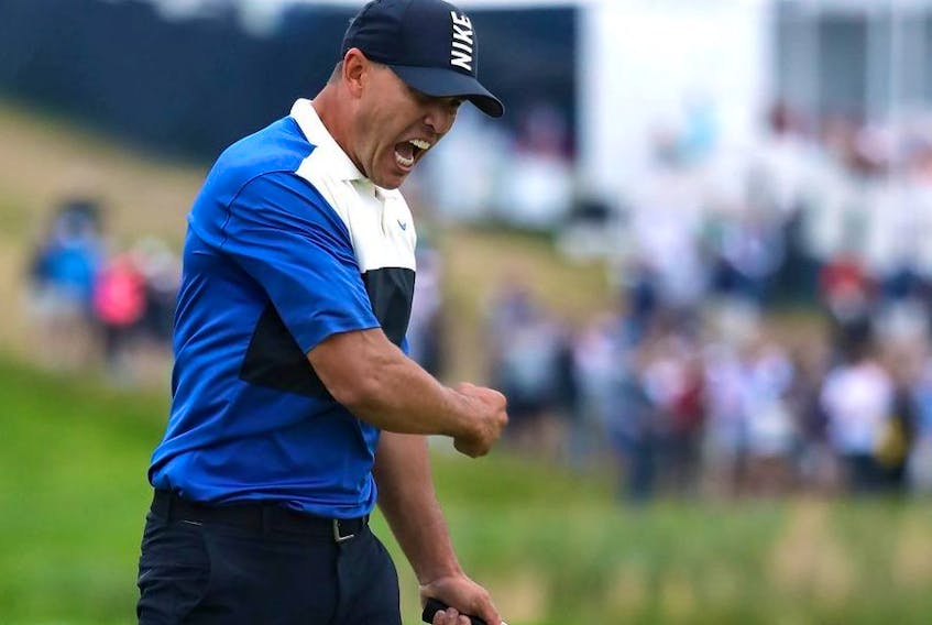 Brooks Koepka of the United States celebrates winning on the 18th green during the final round of the US PGA Championship at Bethpage Black Golf Course on May 19, 2019 in Farmingdale, United States.