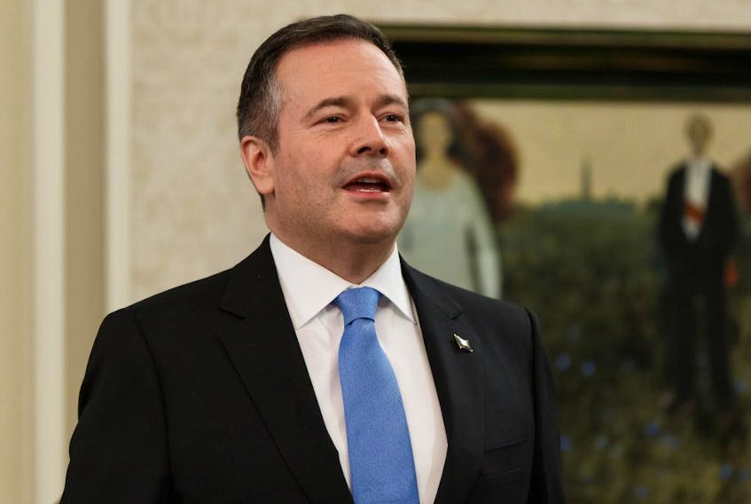 Premier Jason Kenney sings the national anthem before being sworn in as Alberta's 18th Premier at Government House during a ceremony in Edmonton, on Tuesday, April 30, 2019.