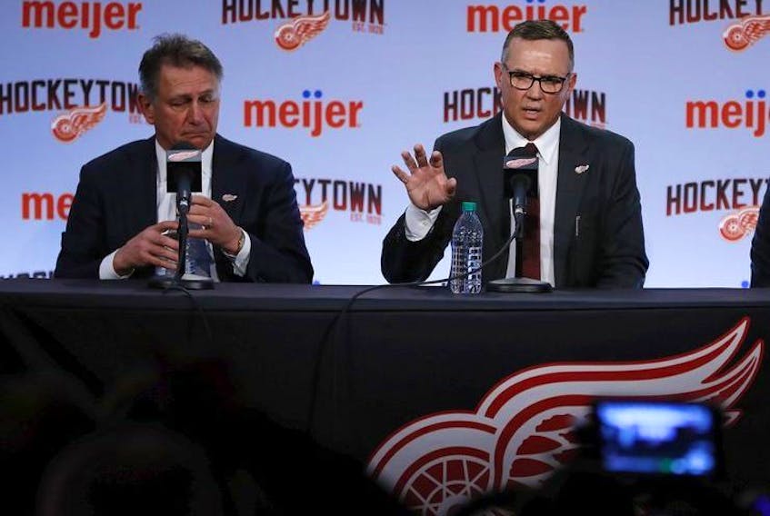  Steve Yzerman, right, addresses media during a press conference where he was introduced as the new executive vice-president and general manager of the Detroit Red Wings, Friday, April 19, 2019, in Detroit.. At left is senior vice-president Ken Holland.
