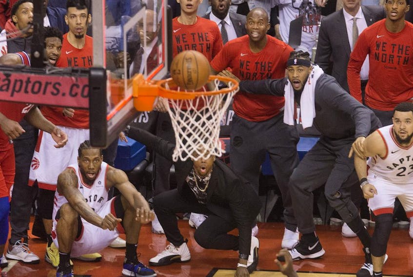 Kawhi Leonard watches as his game-winning shot goes in to clinch the series in Game 7 as the Raptors defeat the Philadelphia 76ers in Toronto.