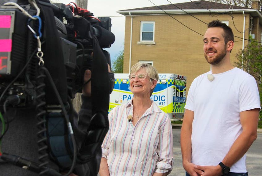Alison Shorey and Harris Lemon of Frontenac Paramedic Services film with the Swiss show Job Swap at the service's Palace Road station in Kingston, Ont., on Wednesday, May 22, 2019. Steph Crosier/The Whig-Standard/Postmedia Network