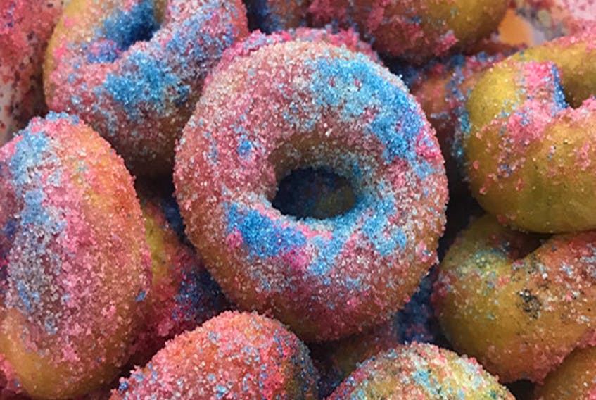 Bring out your inner child with this stellar combination of mini doughnuts and cotton candy. 